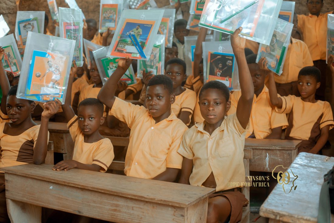A child writing at a school desk