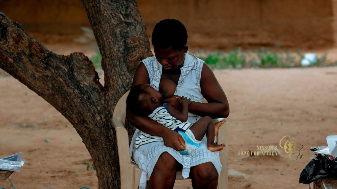 A mother holding her child